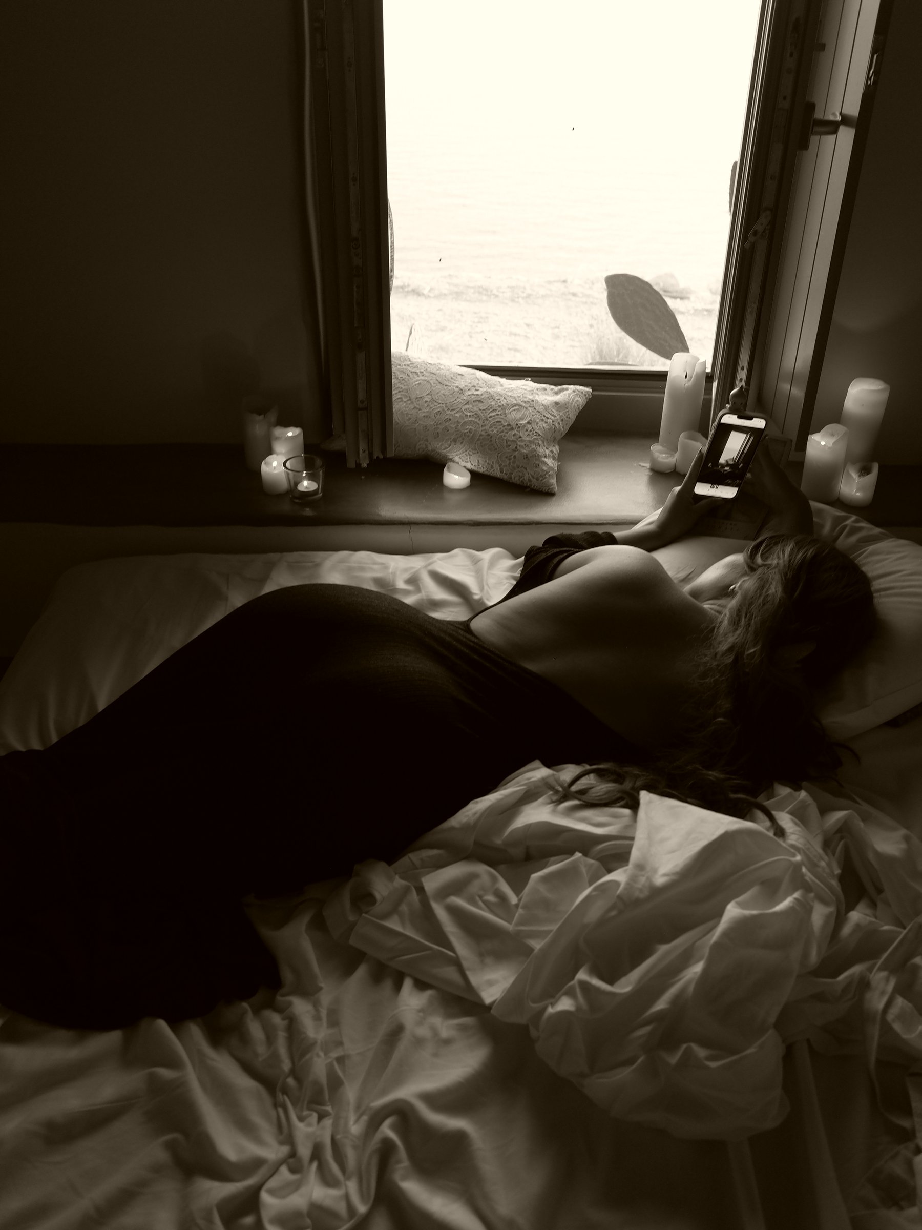 Quiet boudoir study — figure on a train compartment in soft light