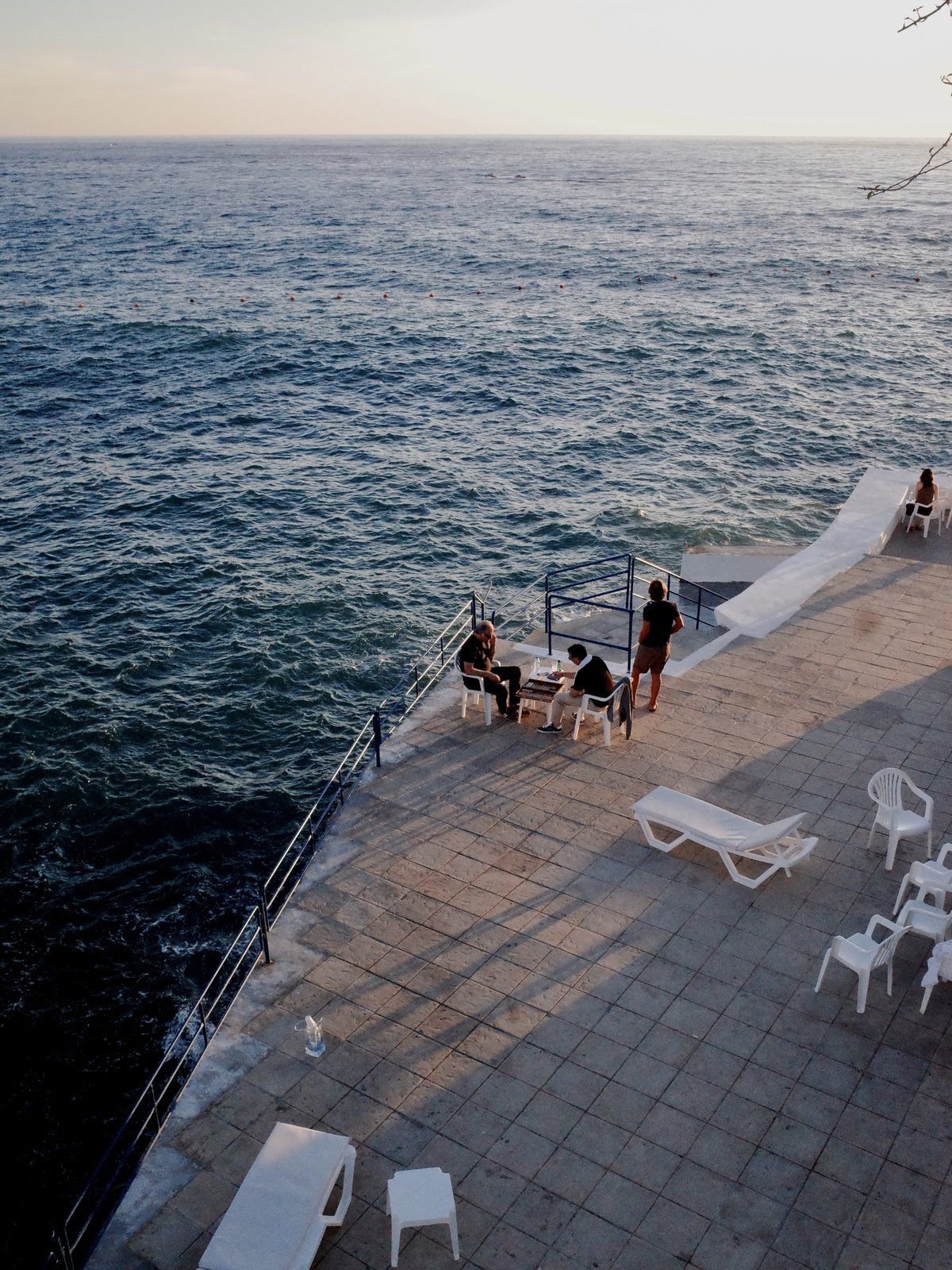 Mediterranean sunset over a stone terrace — colour print